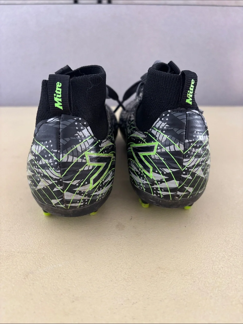 Kids' Black Soccer Cleats with Neon Green Accents